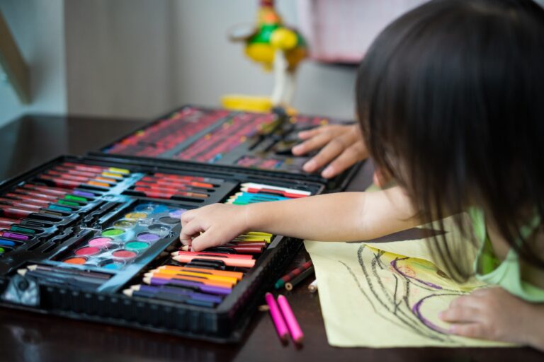 toddler-choosing-colours-while-drawing-on-a-paper-at-home-.jpg